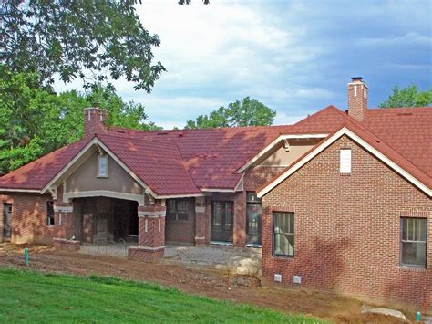 cocoa brown metal roof red brick house|brown house exterior red roof.